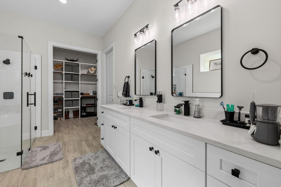 PRIMARY BATH - Double sinks and vanity space.