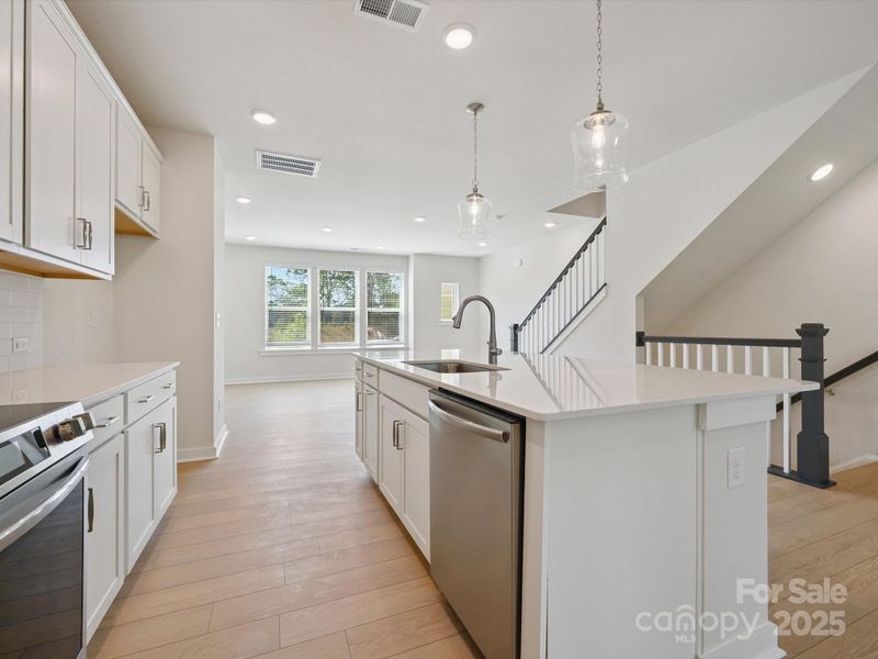 Furnished interior view inside a new home in Central Living at Craig, Charlotte (Image 9).