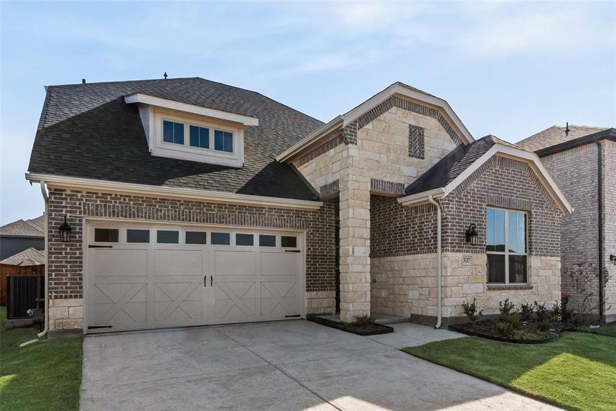 Front exterior of a new home in Villages of Hurricane Creek, Anna, TX, highlighting curb appeal (Image 20). Front exterior of a new home in Villages of Hurricane Creek, Anna, TX, highlighting curb appeal (Image 20).