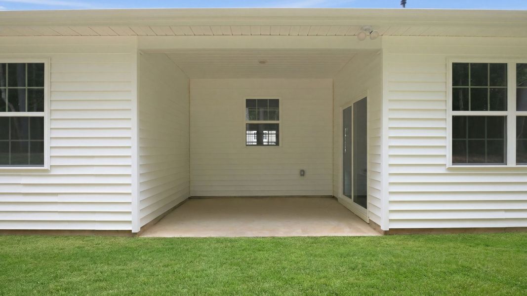 Exterior details and patio area of a home in Tyler - Home on the Lake, New Bern (Image 19).