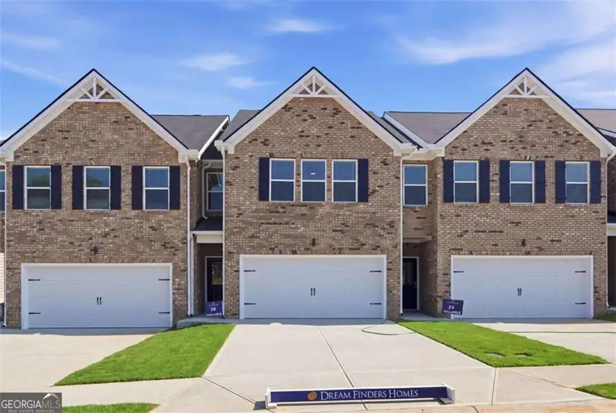 Front exterior of a new home in Parkway James, Snellville, GA, highlighting curb appeal (Image 1). Front exterior of a new home in Parkway James, Snellville, GA, highlighting curb appeal (Image 1).