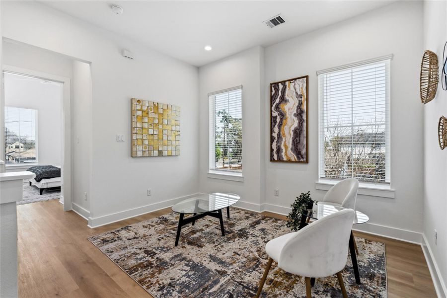 Large windows provide expansive views and maintain the home's airy, voluminous feel.