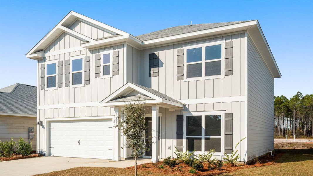 Front exterior of a new home in Bayside at Ward Creek, Panama City Beach, FL, highlighting curb appeal (Image 2).