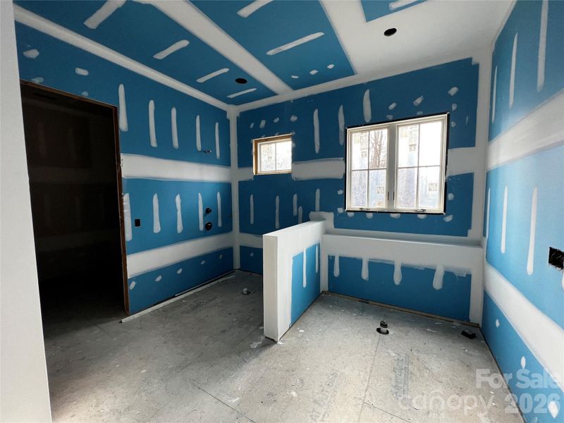 The primary bath features an oversized walk-in tile shower, soaking tub, and double vanities