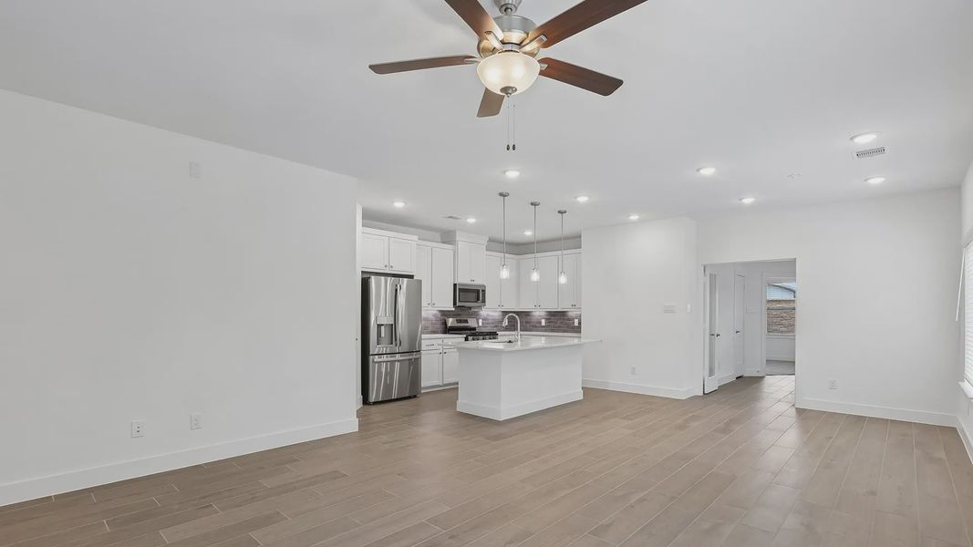 Furnished interior view inside a new home in Meridiana Townhomes, Iowa Colony (Image 5).