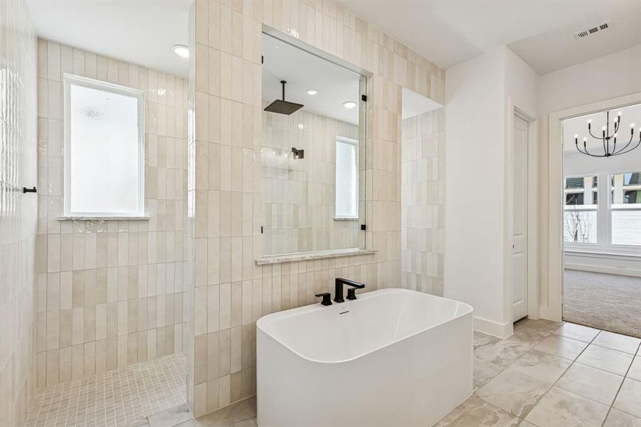 The Justin plan features our signature bath with walk through shower and free standing tub!