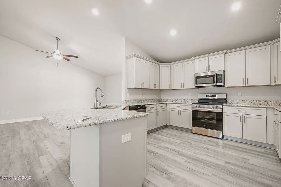 Representative furnished interior of a home built from the Plan 2101 by Adams Homes in The Bluffs at Lafayette, Freeport (Image 5).