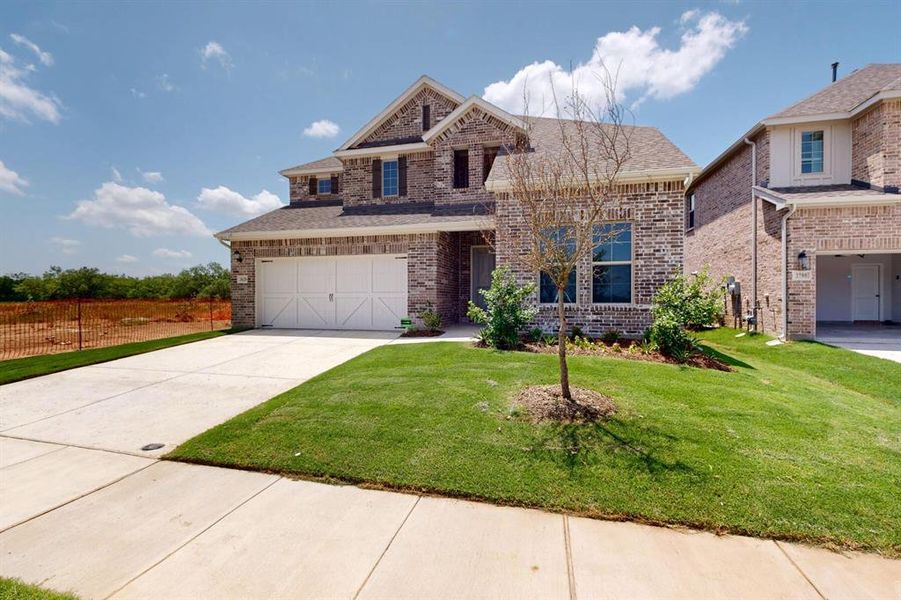 Front exterior of a new home in Lilybrooke at Legacy Hills, Celina, TX, highlighting curb appeal (Image 19).