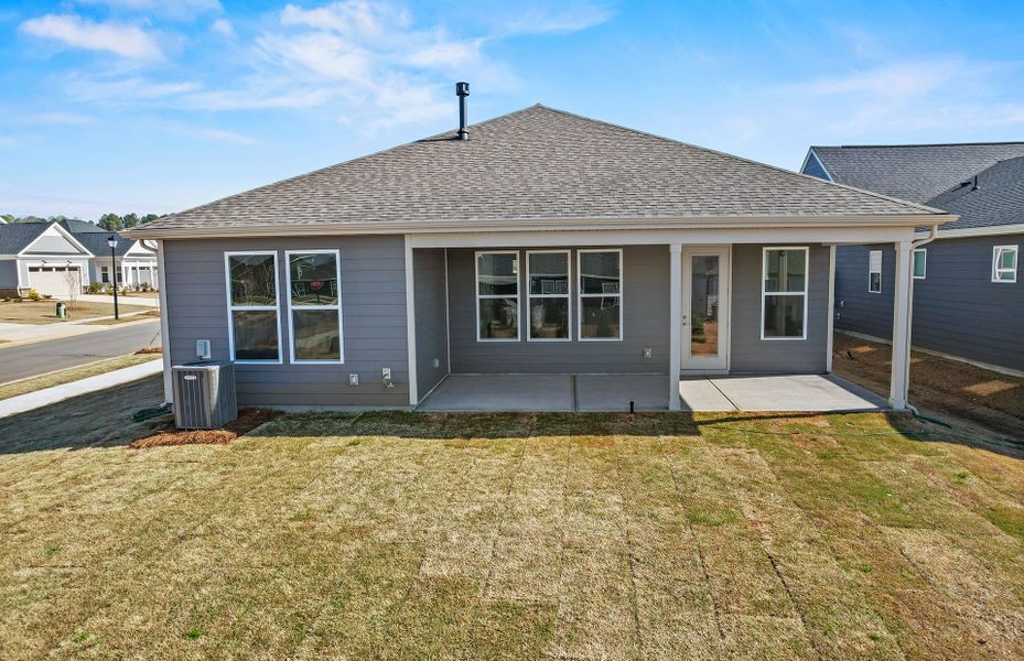 Exterior details and patio area of a home in Carolina Riverside, Belmont (Image 29).