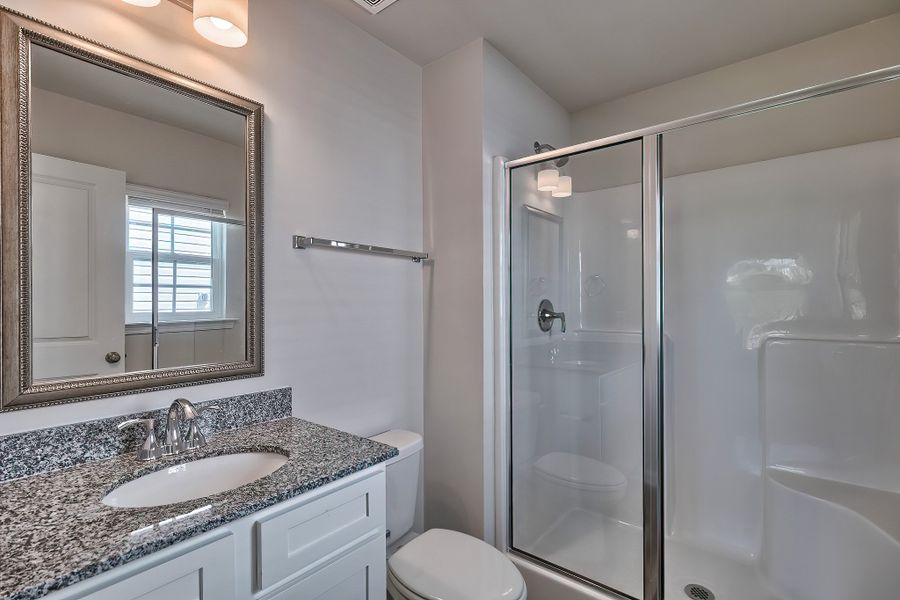 Representative furnished interior of a home built from the Juniper by McGuinn Homes in Hunters Branch, Hopkins (Image 6).
