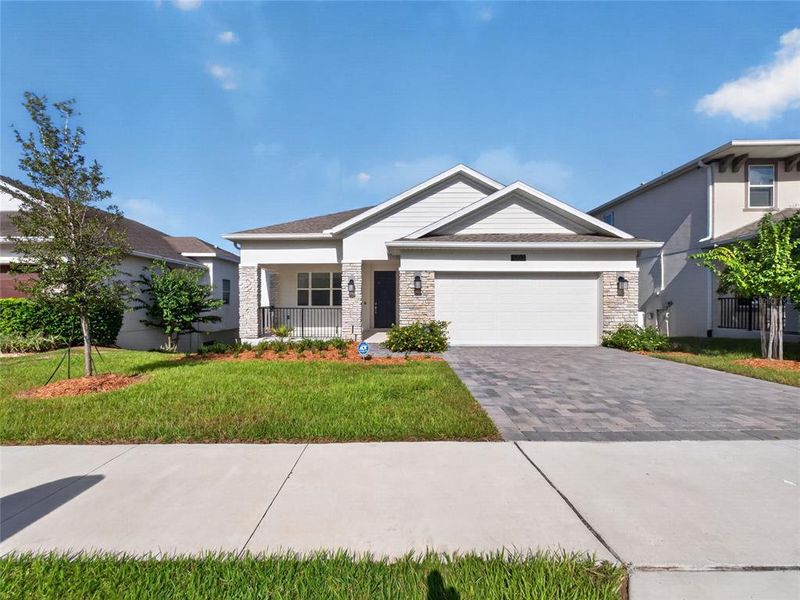 Front exterior of a new home in Dora Parc, Mount Dora, FL, highlighting curb appeal (Image 17).