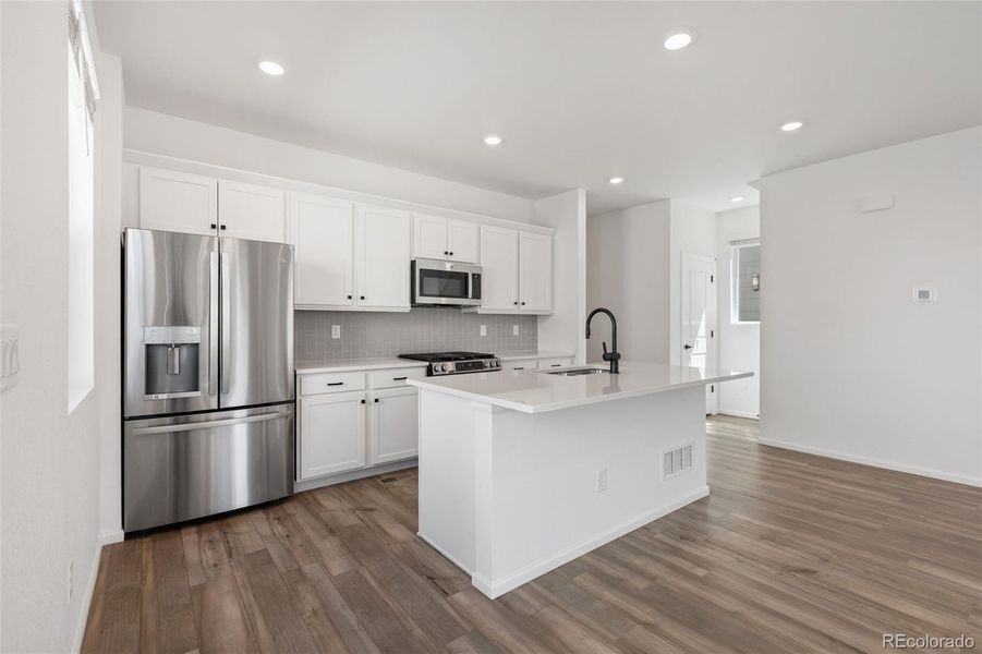 Furnished interior view inside a new home in Woodrose at Painted Prairie, Aurora (Image 12).