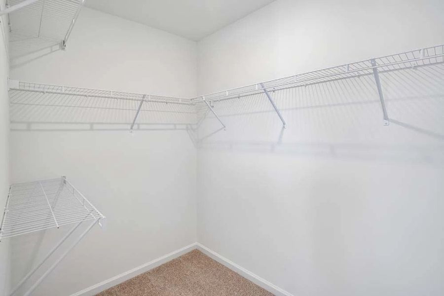 Primary Bedroom Walk-In Closet Primary Bedroom Walk-In Closet