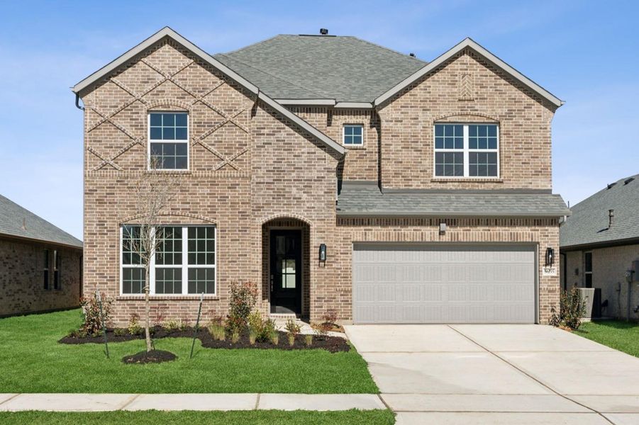 Front exterior of a new home in Saint Tropez, Huffman, TX, highlighting curb appeal (Image 20).