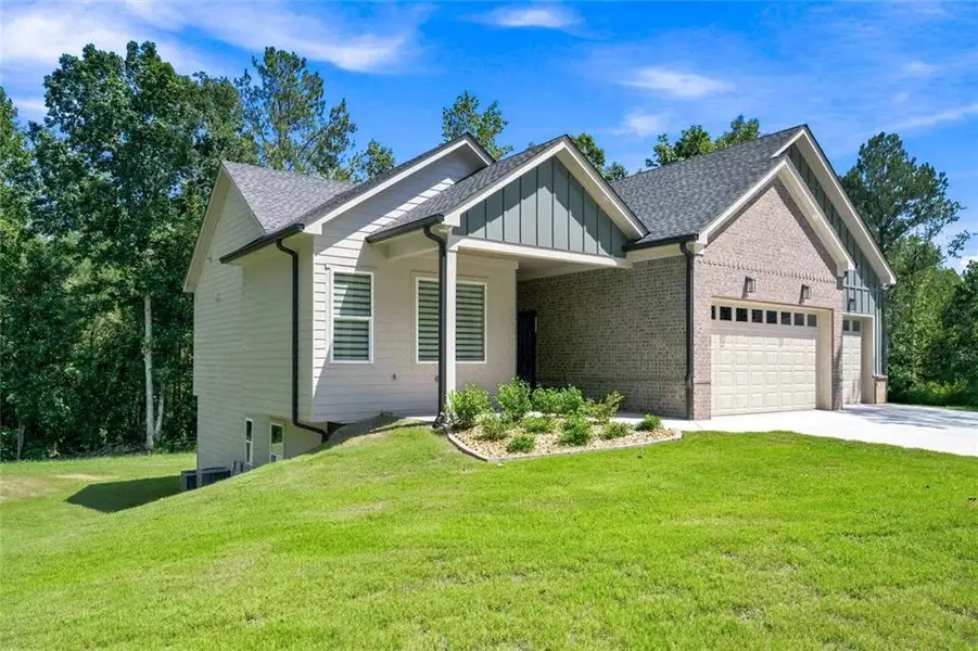 Front exterior of a new home in , Monroe, GA, highlighting curb appeal (Image 2). Front exterior of a new home in , Monroe, GA, highlighting curb appeal (Image 2).