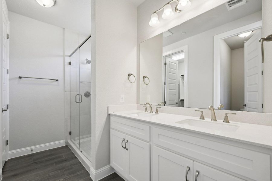 Primary Bath retreat with dual vanities & walk-in shower