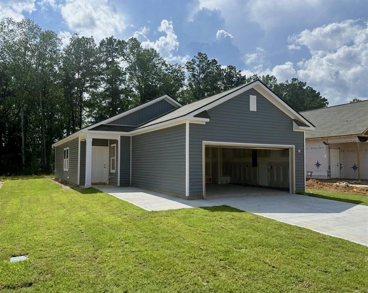 Front exterior of a new home in Watson Hill, Summerville, SC, highlighting curb appeal (Image 1). Front exterior of a new home in Watson Hill, Summerville, SC, highlighting curb appeal (Image 1).