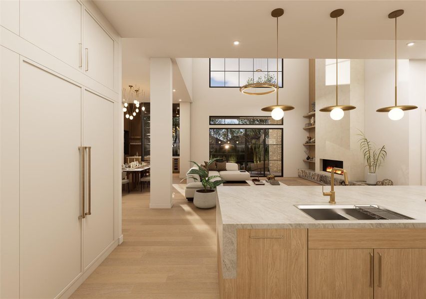 From the kitchen, sightlines extend effortlessly into a dramatic two-story living space where towering windows frame the outdoors and natural light pours in. A sleek linear fireplace anchors the room, while floating shelves and warm textures create an atmosphere that feels both curated and comfortably lived-in. From the kitchen, sightlines extend effortlessly into a dramatic two-story living space where towering windows frame the outdoors and natural light pours in. A sleek linear fireplace anchors the room, while floating shelves and warm textures create an atmosphere that feels both curated and comfortably lived-in.
