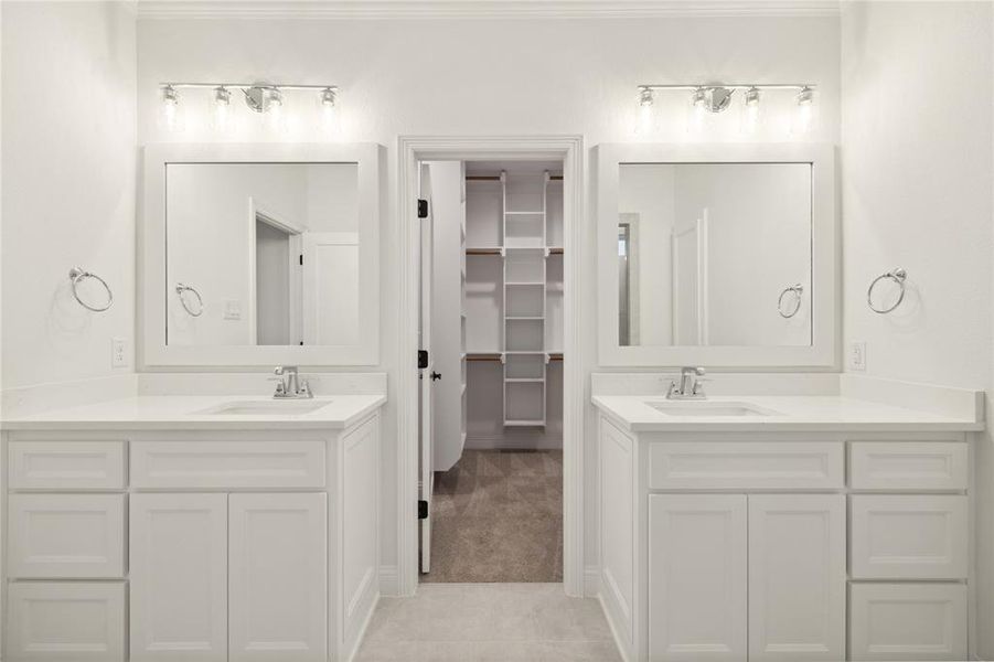 Bathroom featuring vanity and tile patterned flooring