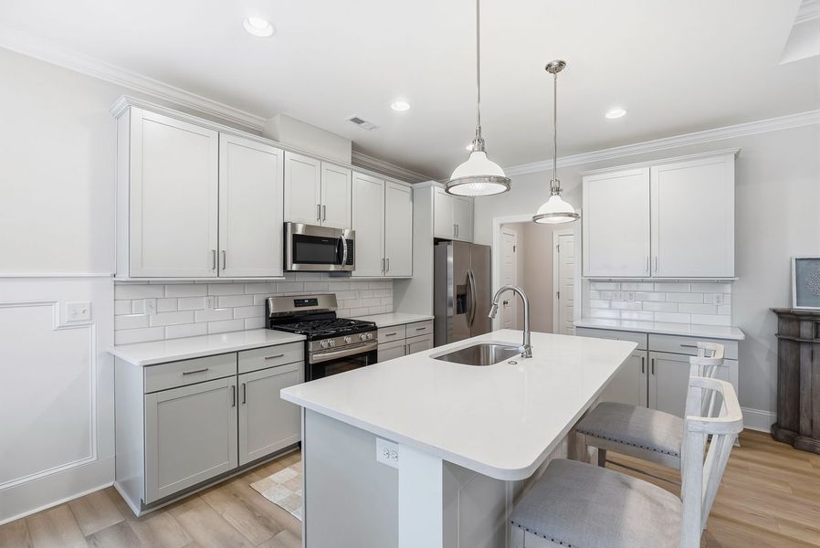 Representative furnished interior of a home built from the Kauai by Bill Clark Homes in The Sanctuary at Sunset Beach, Sunset Beach (Image 13).