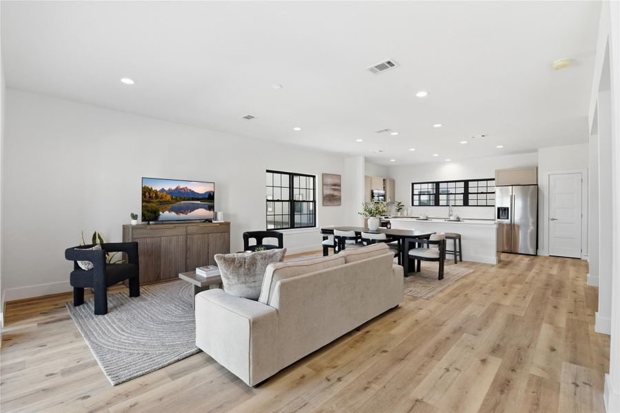 A spacious open-concept living area with modern design.