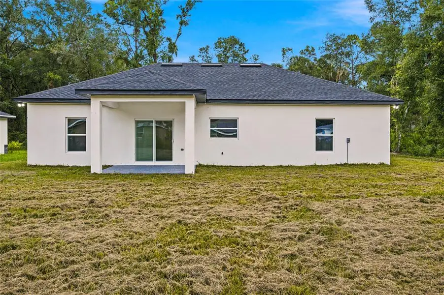 Exterior details and patio area of a home in , Summerfield (Image 21).