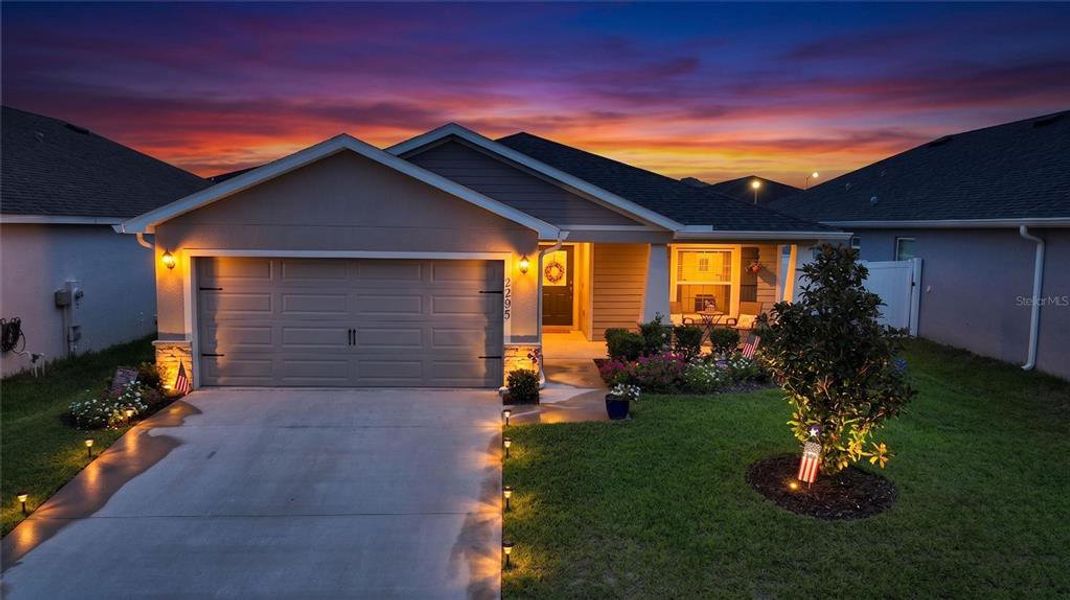 Front exterior of a new home in , Davenport, FL, highlighting curb appeal (Image 22). Front exterior of a new home in , Davenport, FL, highlighting curb appeal (Image 22).