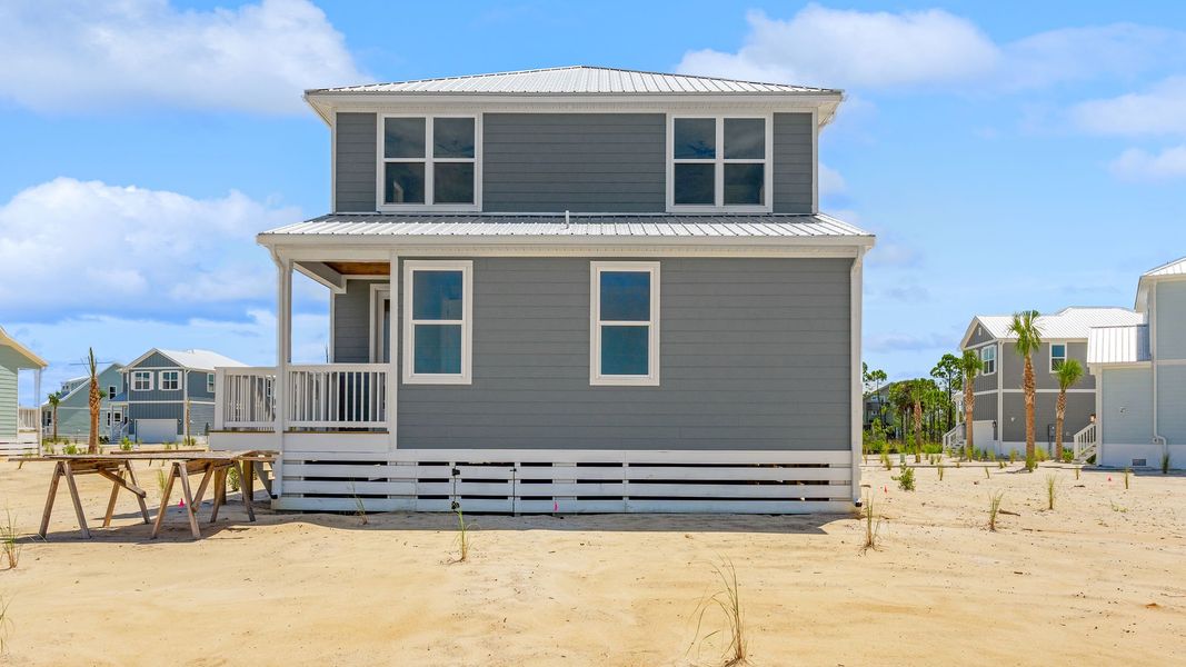 Front exterior of a new home in Redfish Cove at Cape San Blas, Port Saint Joe, FL, highlighting curb appeal (Image 24).