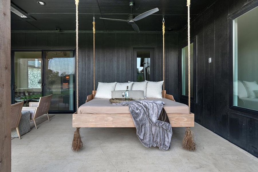 Bedroom with concrete floors and ceiling fan