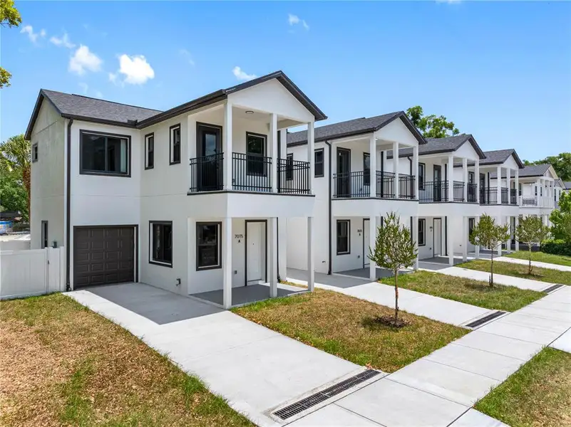 Front exterior of a new home in , Tampa, FL, highlighting curb appeal (Image 24).