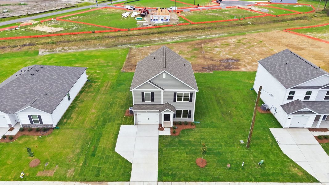 Front exterior of a new home in Hobbs Farm, Ayden, NC, highlighting curb appeal (Image 22).