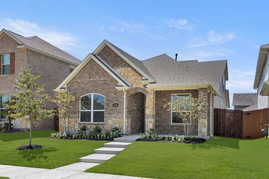 Front exterior of a new home in Heartland, Heartland, TX, highlighting curb appeal (Image 14). Front exterior of a new home in Heartland, Heartland, TX, highlighting curb appeal (Image 14).
