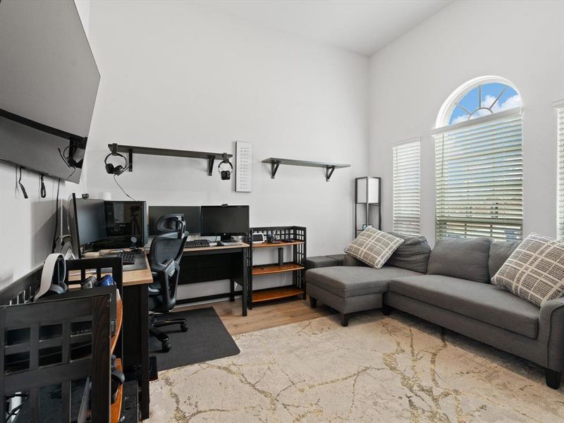 Home office with light hardwood / wood-style flooring