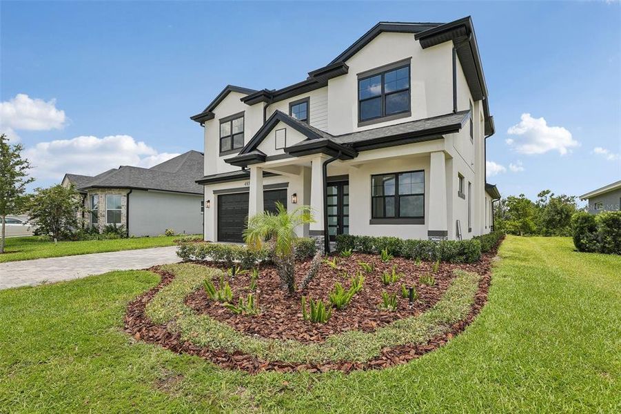 Front exterior of a new home in , Auburndale, FL, highlighting curb appeal (Image 26).