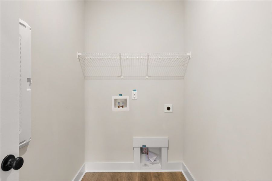 This dedicated laundry space offers practical desi