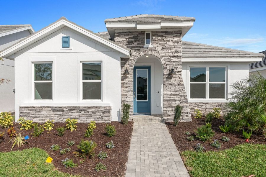 Representative exterior photo of a completed home built from the The Boundary by David Weekley Homes in Vistera of Venice – Cottage Series, Nokomis, FL (Image 2).