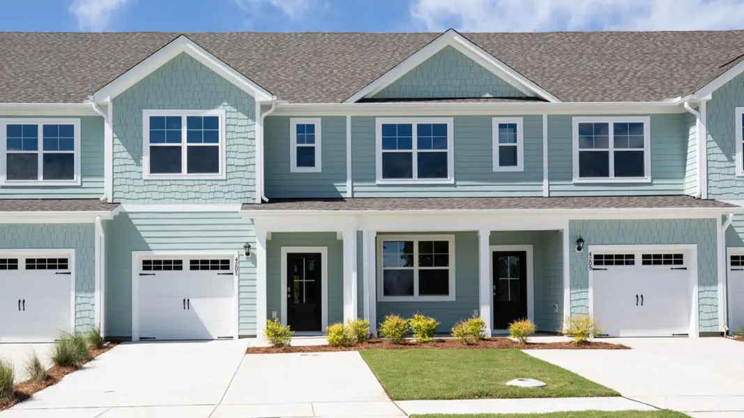 Representative exterior photo of a completed home built from the CARDINAL by D.R. Horton in Indigo Preserve Townhomes, Leland, NC (Image 1).
