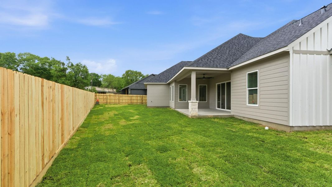 Exterior details and patio area of a home in , New Waverly (Image 19).