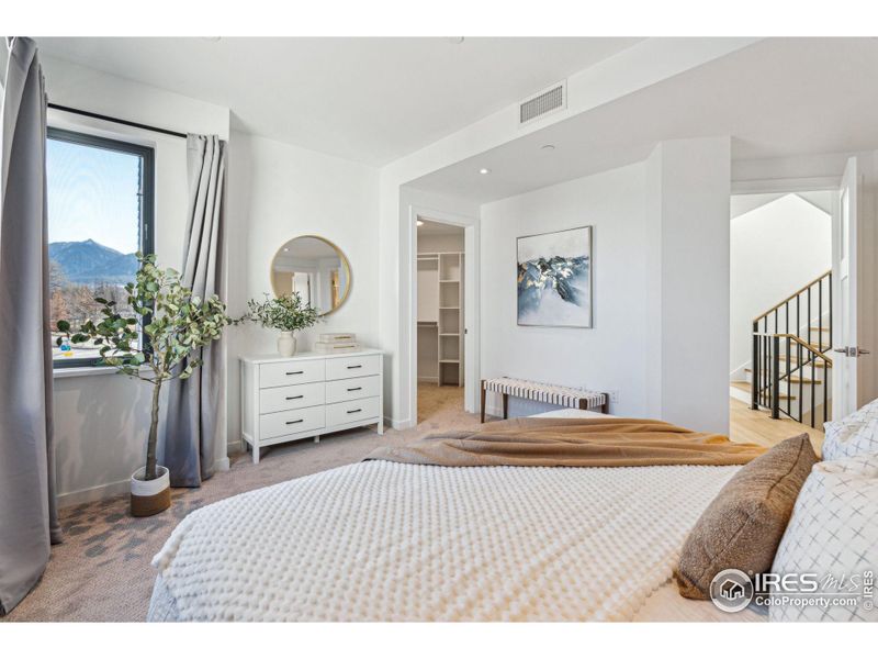 Primary bedroom with peek a boo window with mountain view on2nd floor