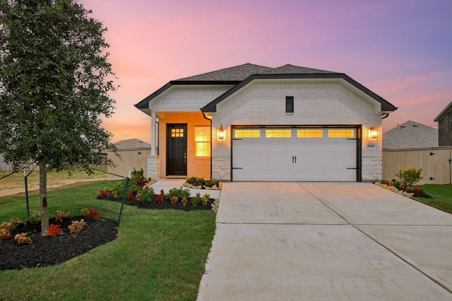 Front exterior of a new home in Oakberry Trails, Waller, TX, highlighting curb appeal (Image 2). Front exterior of a new home in Oakberry Trails, Waller, TX, highlighting curb appeal (Image 2).