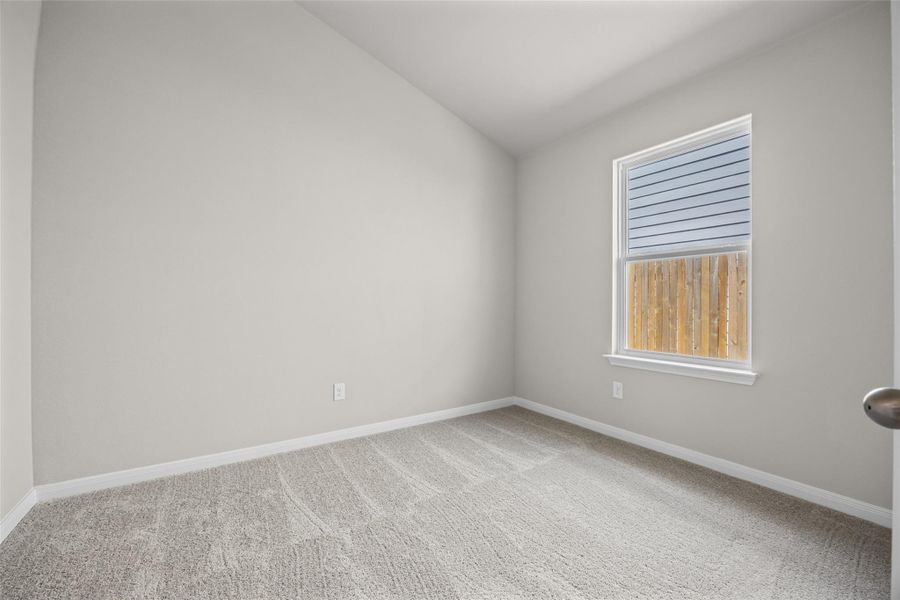 Vaulted ceilings and plush carpeting define this versatile secondary room. Vaulted ceilings and plush carpeting define this versatile secondary room.