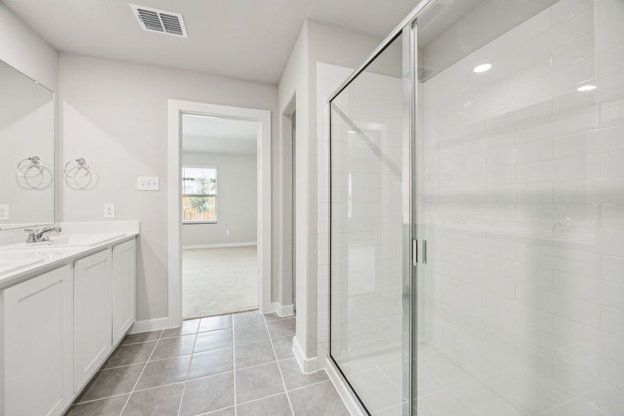 Primary Bathroom in the Hayden home plan by Trophy Signature Homes – REPRESENTATIVE PHOTO