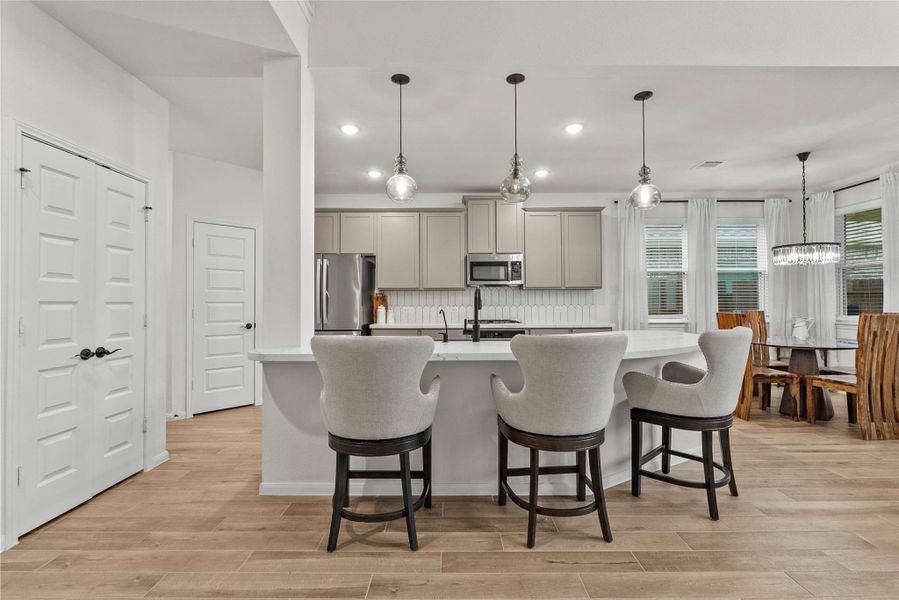 Breakfast has bar off of kitchen