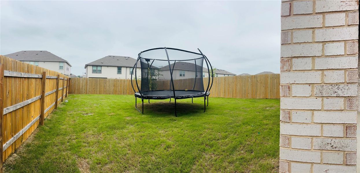 HUGE Backyard, covered patio and wood privacy fence. HUGE Backyard, covered patio and wood privacy fence.