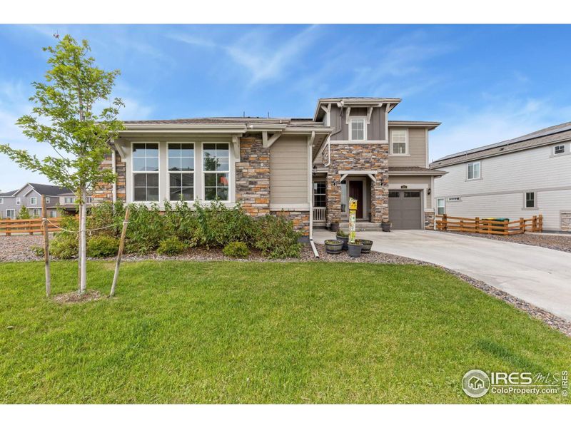 Front exterior of a new home in , Erie, CO, highlighting curb appeal (Image 20).
