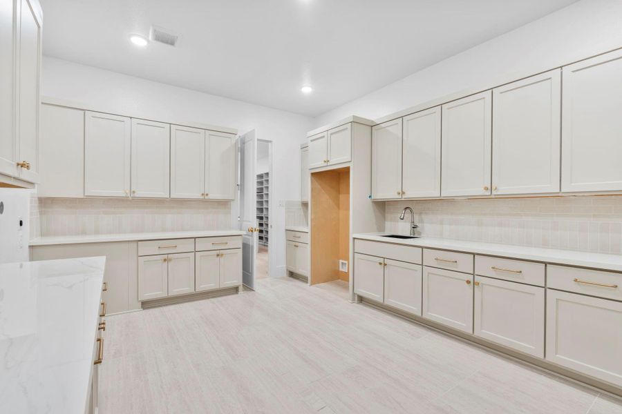 Oversized utility room for maximum functionality. Representative image.
