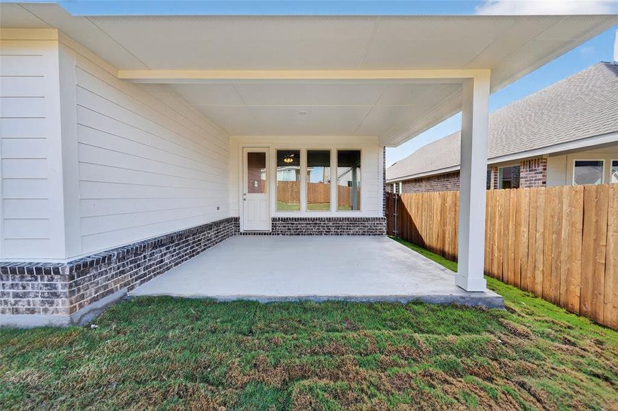 Property entrance with a patio