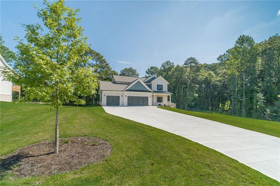 Front exterior of a new home in , Loganville, GA, highlighting curb appeal (Image 27).