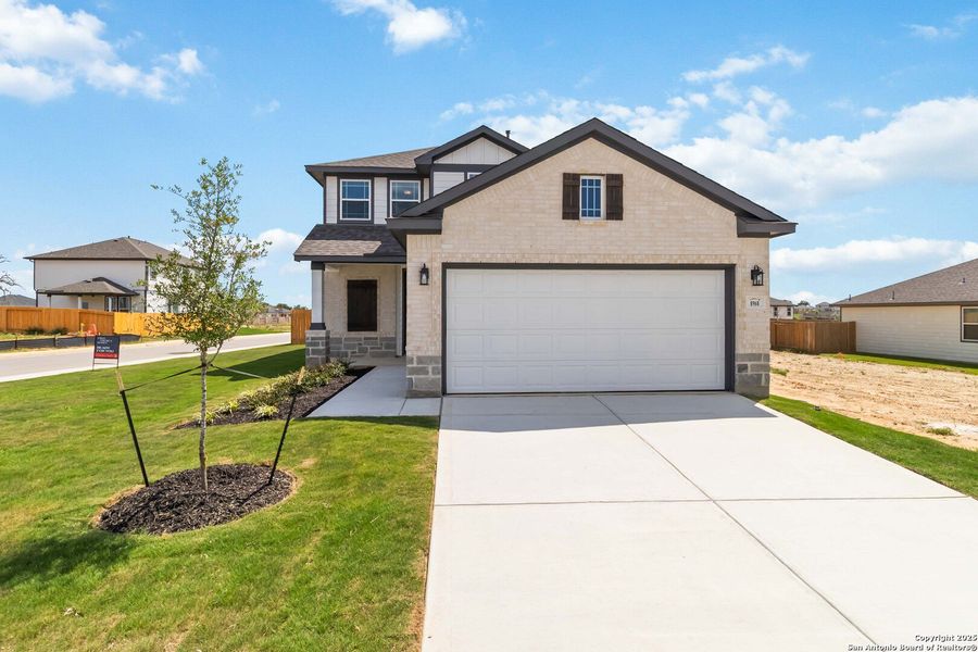 Front exterior of a new home in Hickory Ridge, Elmendorf, TX, highlighting curb appeal (Image 20).
