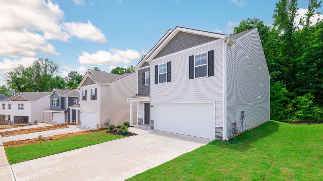 Front exterior of a new home in Hawk's Ridge, Rossville, GA, highlighting curb appeal (Image 22).